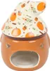 A ceramic oil burner shaped like a gnome with an autumn-themed pattern. Voir les images du produit
