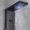 A modern shower system with a rainfall showerhead and a handheld showerhead, featuring LED lights and a digital display. Náhled obrázku produktu