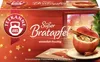A box of Teekanne 'Süßer Bratapfel' (Sweet Baked Apple) fruit tea, featuring a festive winter theme with an image of a baked apple and a Christmas tree. Produktbild-Vorschau