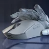 A robotic hand is shown interacting with a computer mouse. Podgląd zdjęcia produktu