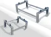 Two metal stands, likely for an air conditioning unit or heat pump, are displayed on a white and gray surface. Produktbild-Vorschau