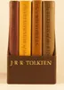 A set of four books by J.R.R. Tolkien, including 'The Hobbit' and 'The Lord of the Rings' trilogy, displayed in a brown slipcase. Produktbild-Vorschau