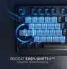 A close-up of a black gaming keyboard with blue backlighting, highlighting the 'Easy-Shift' feature. Produktbild-Vorschau