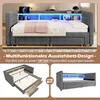 A multi-functional pull-out bed with LED lighting and storage drawers, shown in both a closed and partially extended state. Voir les images du produit