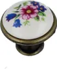 A single decorative knob with floral patterns. Produktbild-Vorschau