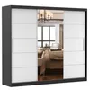 A wardrobe with mirrored doors reflecting a bedroom interior. Produktbild-Vorschau