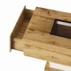 Close-up view of a wooden coffee table with an open drawer and a black framed glass insert. Produktbild-Vorschau