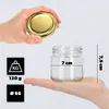 A hand holds a golden lid above a glass jar, with measurement indicators and weight information displayed. Produktbild-Vorschau