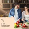 A couple preparing food in a kitchen. Produktbild-Vorschau