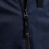 A close-up view of a dark blue jacket zipper. Produktbild-Vorschau