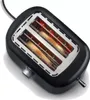 A black two-slice toaster with glowing heating elements and two slices of bread inside, shown from a diagonal top-down perspective. Náhled obrázku produktu