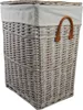 A close-up view of a wicker laundry basket with a fabric liner and leather handles. Produktbild-Vorschau