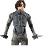 A full-body shot of a male action figure wearing a futuristic suit and holding two knives. Anteprima dell’immagine prodotto