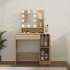 A makeup vanity with a lighted mirror and storage compartments. Produktbild-Vorschau