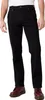 A person wearing black jeans and brown shoes, shown from the waist down. Produktbild-Vorschau