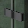 A close-up view of a shower hinge on a glass shower door. Podgląd zdjęcia produktu