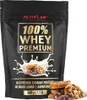 A bag of Activlab 100% Whey Premium protein powder with cookies and milk splash. Produktbild-Vorschau