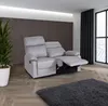 A light gray recliner sofa is shown in a living room setting with a large window and a plant. Produktbild-Vorschau