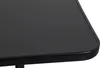 A close-up view of the corner of a black table. Produktbild-Vorschau
