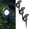 A split image showing a solar-powered garden spotlight in use in a garden on the left, and three such spotlights on a white background on the right. Produktbild-Vorschau