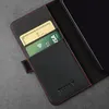 A close-up view of a black leather wallet case for a phone, showing two credit cards inserted into slots. Produktbild-Vorschau