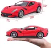 A red Ferrari F12TDF model car is shown from two angles, with dimensions indicated. Produktbild-Vorschau