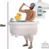 A man wearing an inflatable bathtub costume with a rubber duck and faucet, holding a bath brush. Náhled obrázku produktu