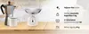A kitchen scale, coffee pot, and mug are displayed on a wooden surface against a textured wall. Voir les images du produit