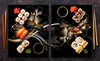 A collage of two images featuring sushi and decorative flowers on a black background. Náhľad obrázku produktu