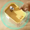 A cat is drinking from a pet water fountain. Produktbild-Vorschau