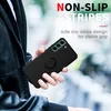 A person is holding a black phone case with a ring holder. Produktbild-Vorschau