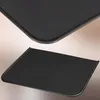 Two views of a black metal hearth plate, one angled from above and one from the side. Náhľad obrázku produktu
