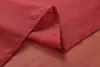 A close-up view of folded red fabric, likely a curtain, showing the texture and stitching. Produktbild-Vorschau