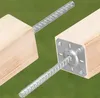 Close-up view of two wooden posts with metal rebar anchors inserted. Anteprima dell’immagine prodotto