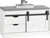 A white shoe bench with a gray upholstered top, featuring two drawers and a sliding barn door with a decorative 'X' pattern. Books and decorative items are placed on top. Anteprima dell’immagine prodotto