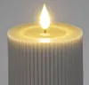 A close-up of a gray LED candle with a flickering flame. Produktbild-Vorschau