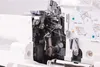 A close-up view of the internal mechanisms of a sewing machine, with threading guides and diagrams visible. Anteprima dell’immagine prodotto
