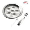 A set of escargot serving dishes, tongs, and a fork on a white background. Produktbild-Vorschau