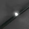 A close-up of a dark gray umbrella with a small LED light illuminated. Produktbild-Vorschau
