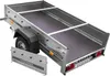 A silver utility trailer with a black floor and a detached front gate, shown from a diagonal angle against a white background. Podgląd zdjęcia produktu