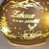 A close-up of a decorative LED glass sphere with a winter scene and German text. Produktbild-Vorschau