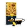 A box of Martello Gourmet Gold Espresso coffee capsules is shown next to a cup of prepared espresso. Produktbild-Vorschau