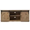 A front view of a wooden TV stand with sliding barn doors. Anteprima dell’immagine prodotto
