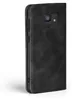 A black flip cover case for a smartphone is shown against a white background. Produktbild-Vorschau