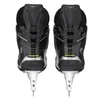 The back view of a pair of black CCM Tacks XF70 ice hockey skates. Podgląd zdjęcia produktu