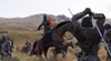A medieval battle scene with soldiers on horseback fighting. Produktbild-Vorschau