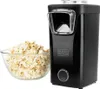 A black Black & Decker popcorn maker is shown next to a bowl of popcorn. Produktbild-Vorschau