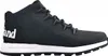A side view of a black Timberland boot with a white sole. Voir les images du produit