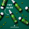 Several bottles of Orientana Ayurvedic hair tonic are arranged on a dark green background, scattered with green berries. Text overlays "TRY ALSO". Produktbild-Vorschau