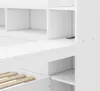 A close-up view of a white bed frame with built-in shelving and drawers. Produktbild-Vorschau